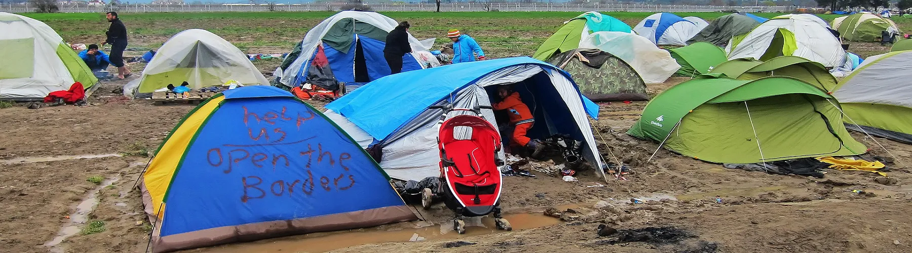 A row of tents in a refugee camp.