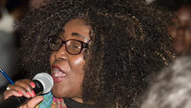 Audience member speaking at a conference
