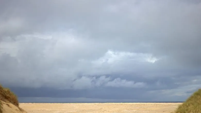 Grey skies over beach