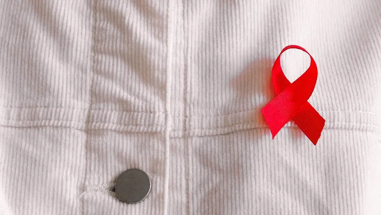 Red AIDS ribbon on a shirt