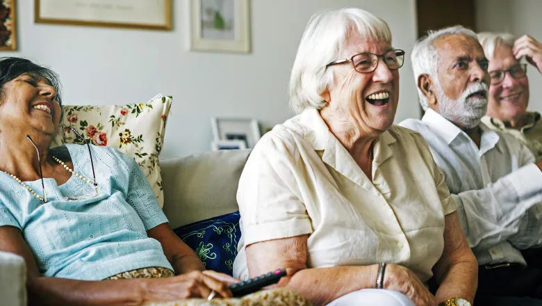 A group of seated cheerful people