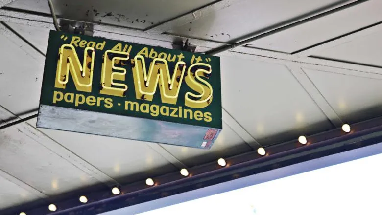 Photo of a sign with the word NEWS on it