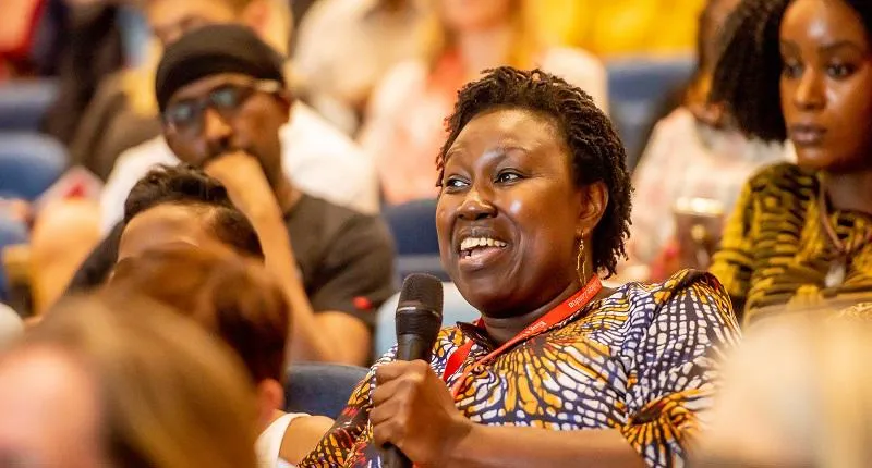 A woman asking a question at an Inaugural Lecture