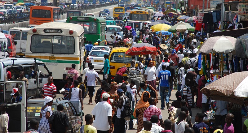 A busy street with people and vehicles in Kenya