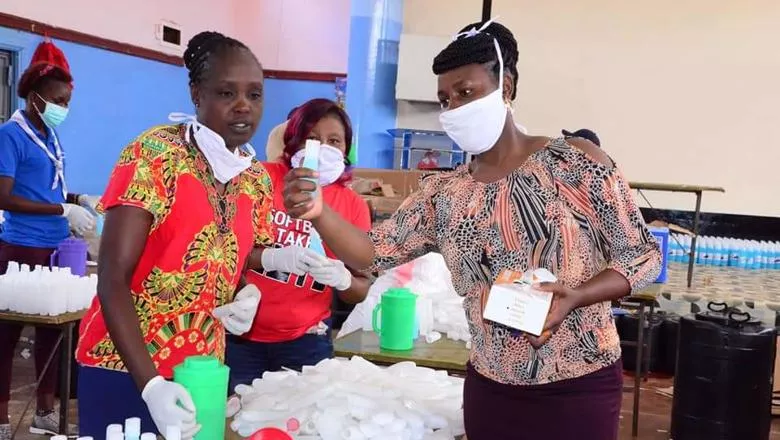 Health workers prepare hand sanitiser, Africa