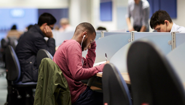 Student in a library at King's College London