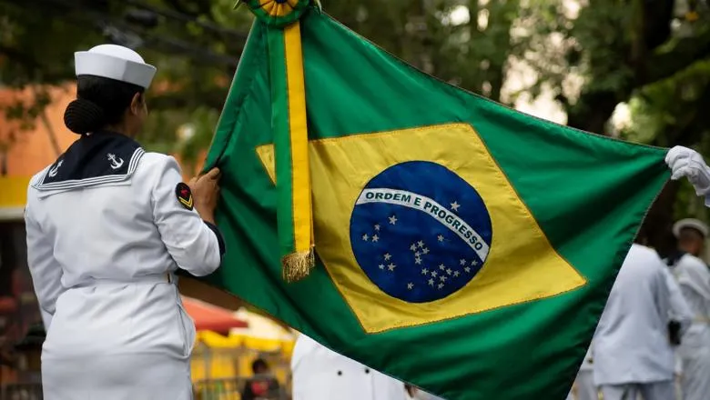female soldier holds the Brazilian flag during the Brazilian independence parade in the city of Salvador, Bahia in 2023