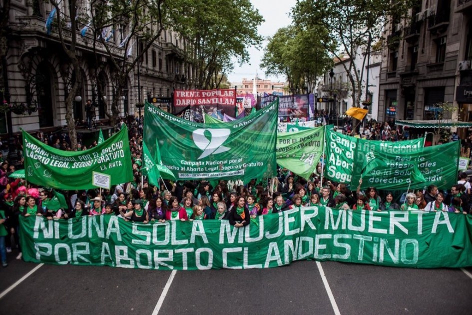 Protesters holding a sign stating Not a single woman dead as a result of clandestine abortion’