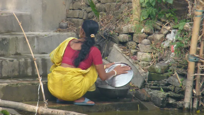 Indian woman doing dishes