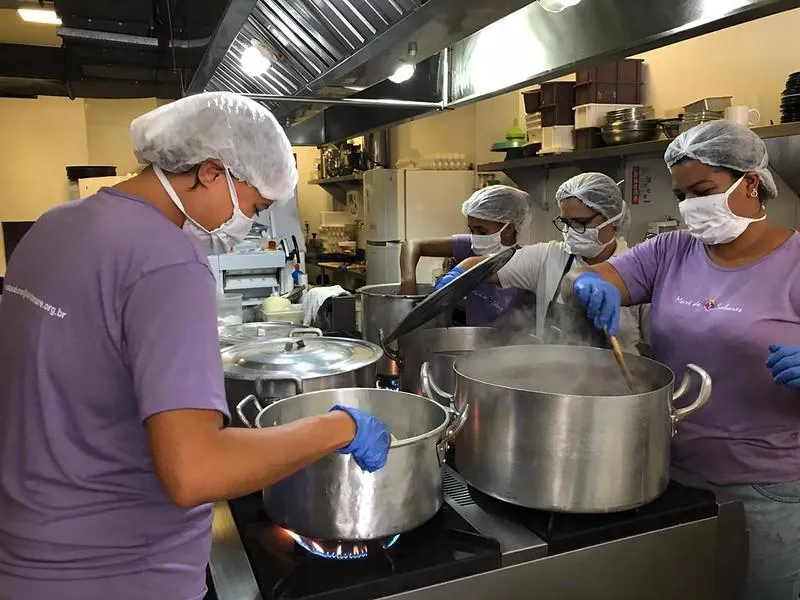 Women cooking in Brazilian favela