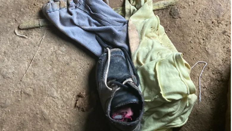 Credit:Claudia Gaitan - A shoe, small trousers and top layed on the ground