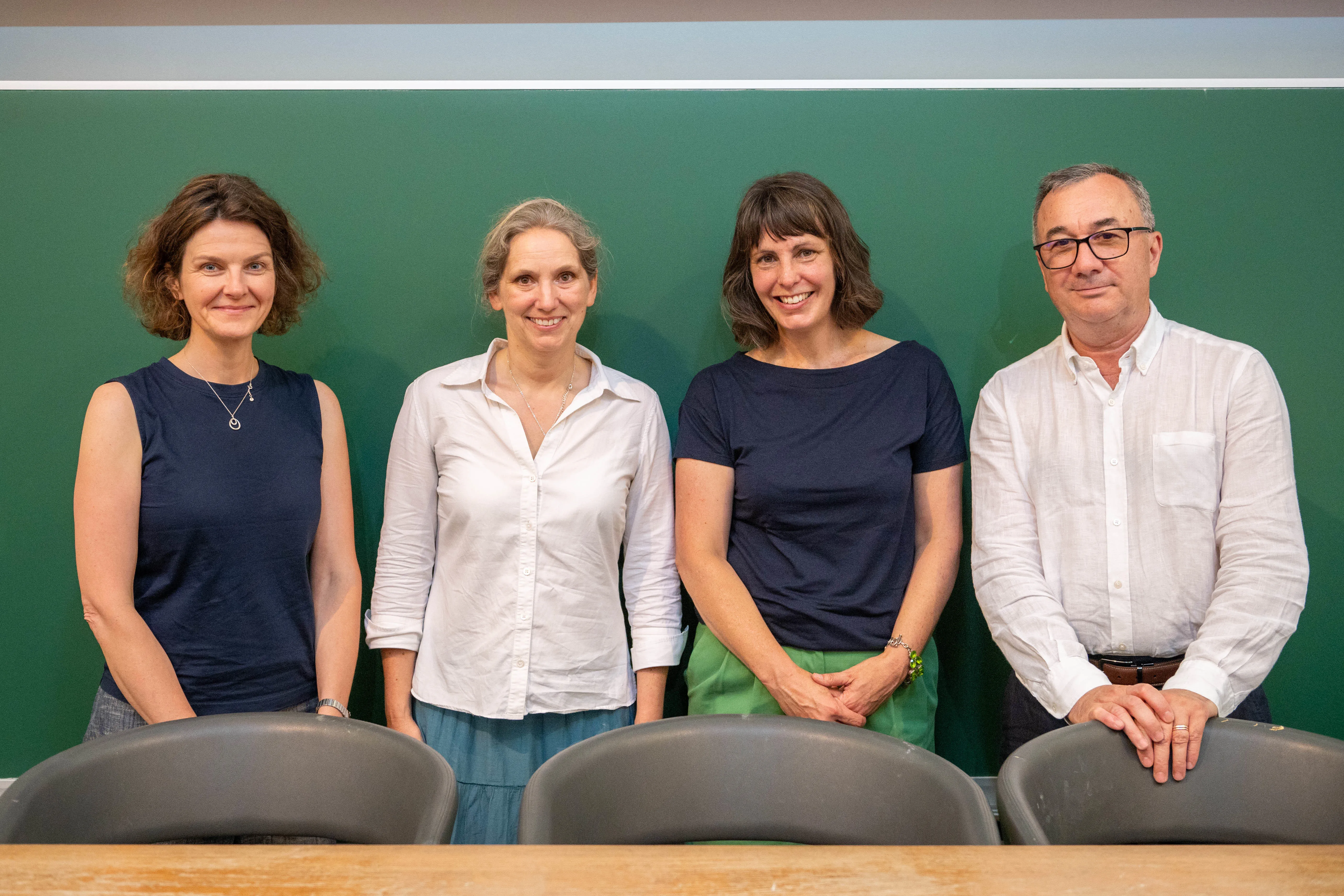 group shot of four people, three white women and one white man