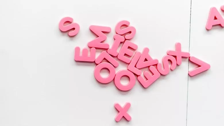 Pink letters on fridge by jason leung