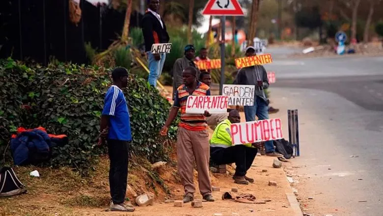 People holding jobs wanted signs in South Africa