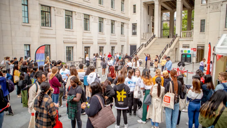 more than 50 students standing in strand courtyard during welcome week