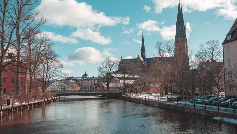 A river and church in Uppsala, Sweden