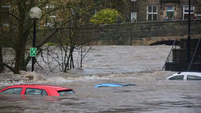 Three cars are under the water from floors in the UK.