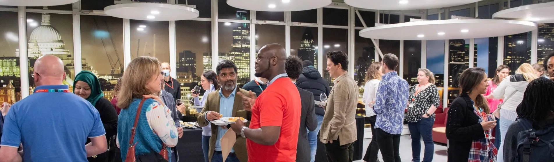 People networking in a King's classroom.