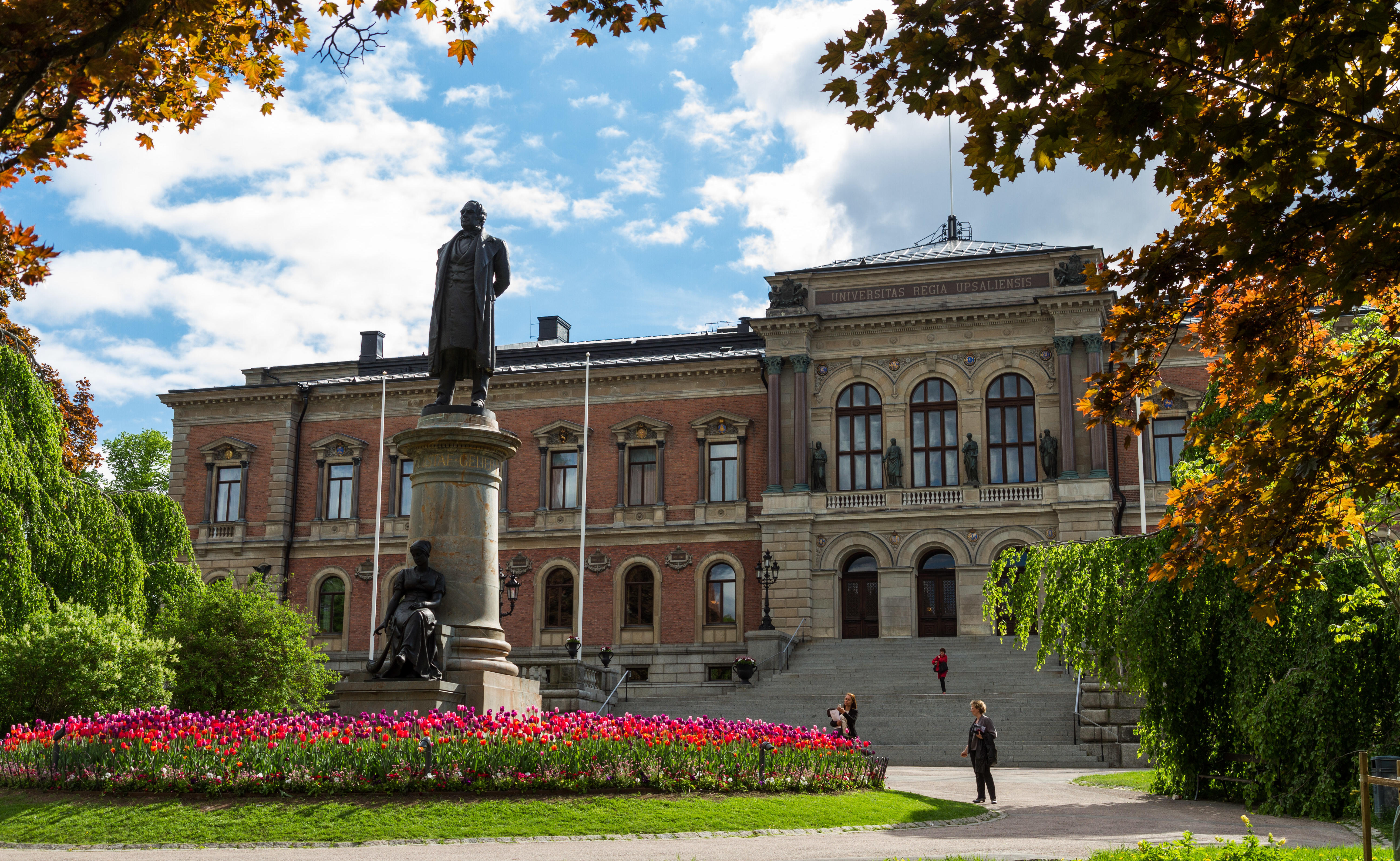 Uppsala University campus building and statue