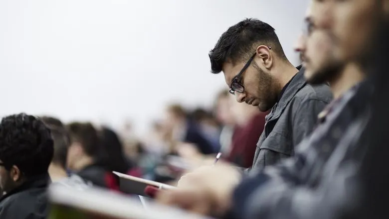 Student in lecture theatre_hero_flipped