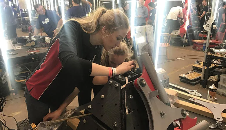 Girls building a robot