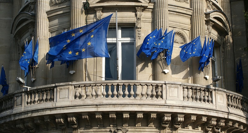 A building with European Union flags flying outside