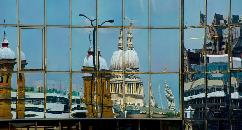 St Paul's reflected in a window along the River Thames