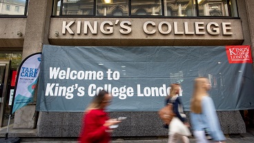 A welcome to King's sign on the outside of the Strand Building