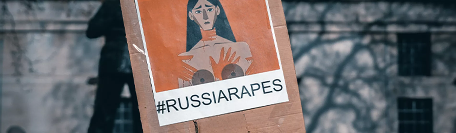 Placard at demonstration about sexual violence in the Ukraine war