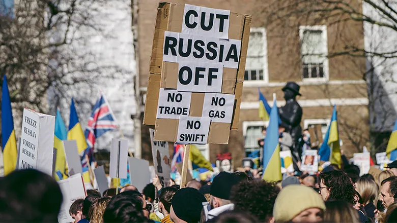 Public protest with placards calling for sanctions against Russia
