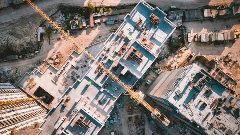 A construction site with cranes viewed from above