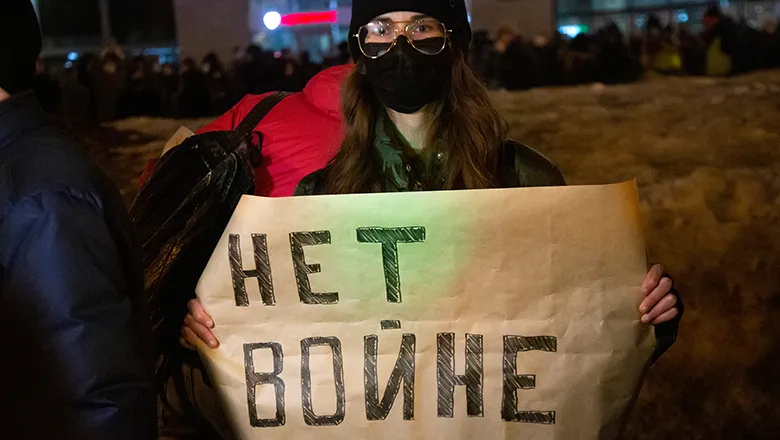 Russian protester holds placard showing opposition to the Ukraine war