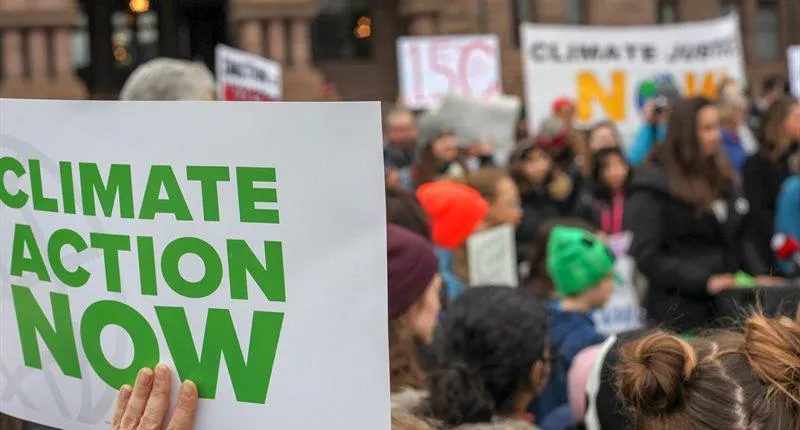 climate action sign at protest