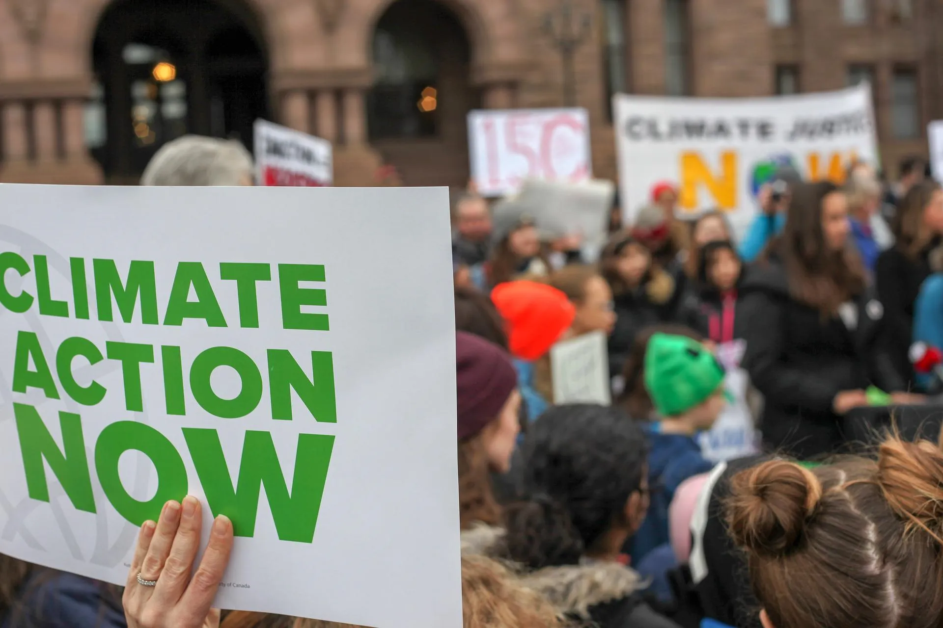 climate action sign at protest