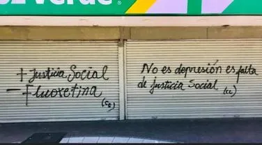 ‘More social justice, less fluoxetine. It was not depression, it was lack of social justice’. Graffi  ti on the front of a pharmacy (Santiago, Chile)