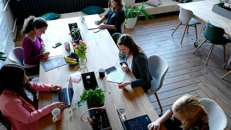 Women sat at a table in an office