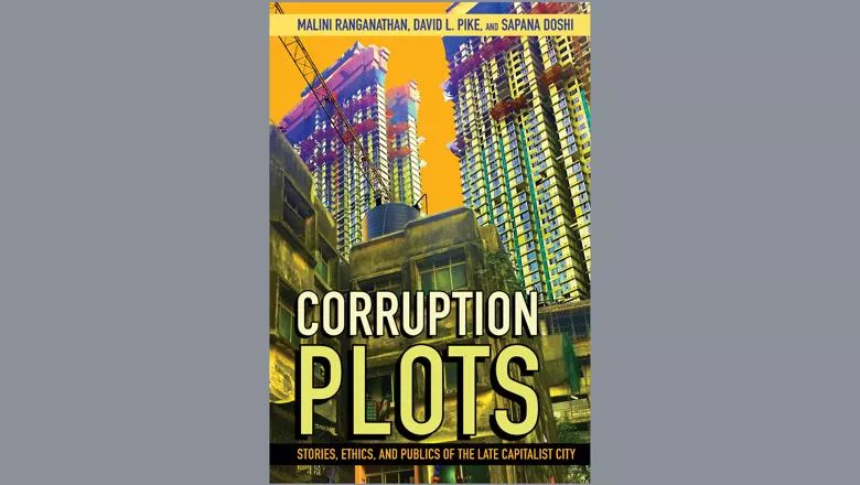 Book cover with the title against a background image of tall buildings in an Indian city