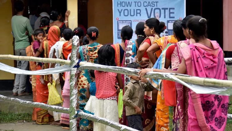 Voters lining up to cast their vote, India