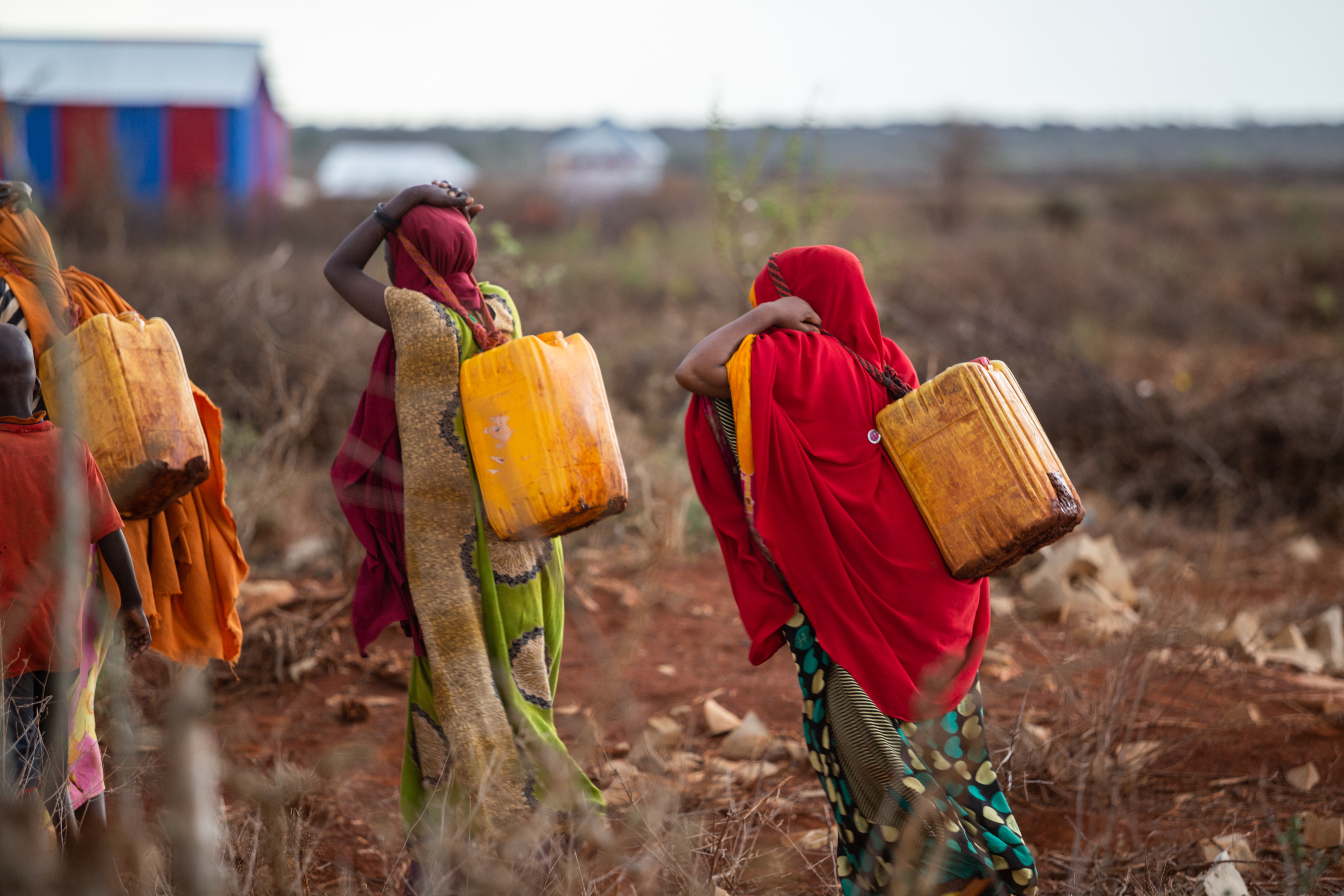 Women carrying water in Baidoa, Somalia