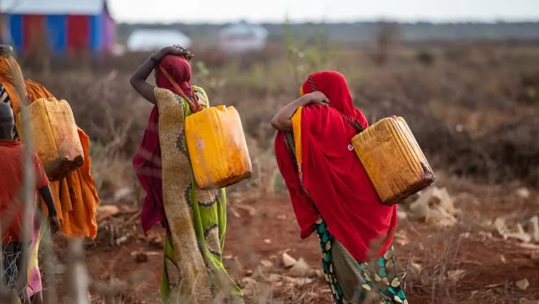 Women carrying water in Baidoa, Somalia