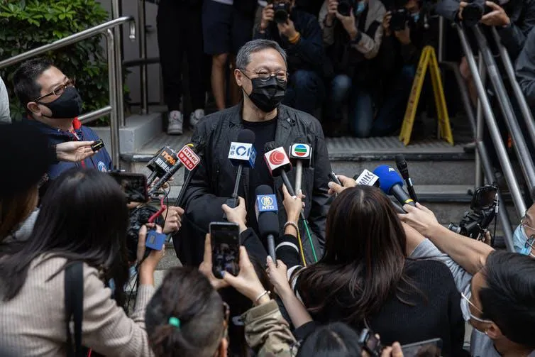 Hong Kong democracy activist Benny Tai Yiu-ting speaks to the press before reporting to the police, February 29 2021.
