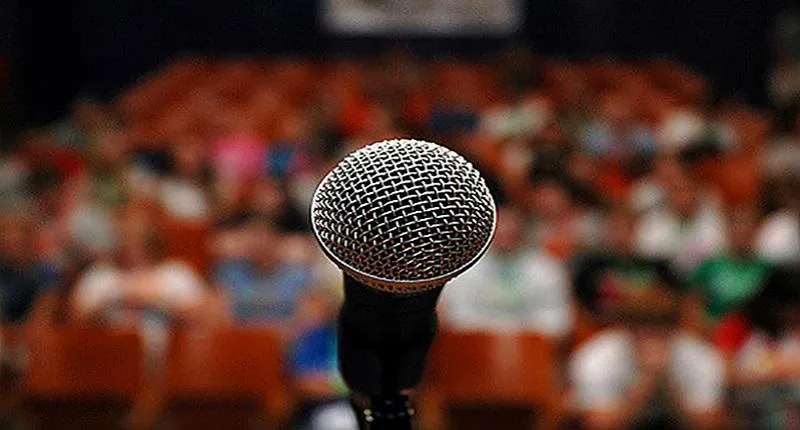 A microphone in front of an audience