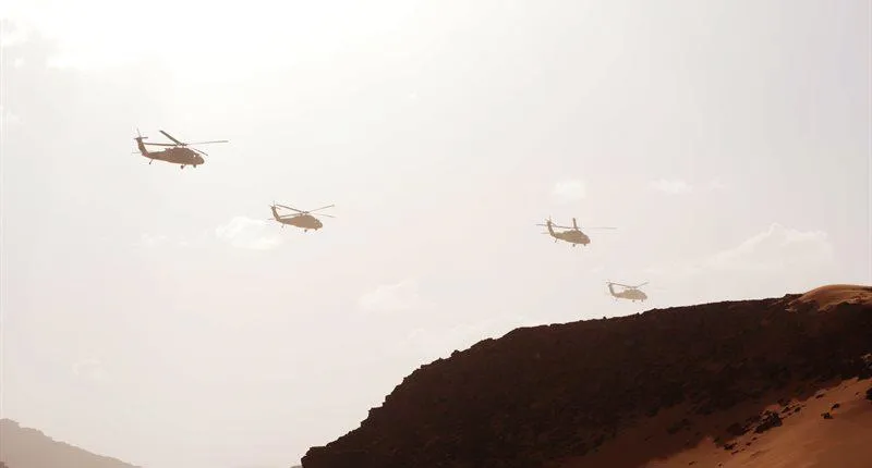 Military aircraft over a desert