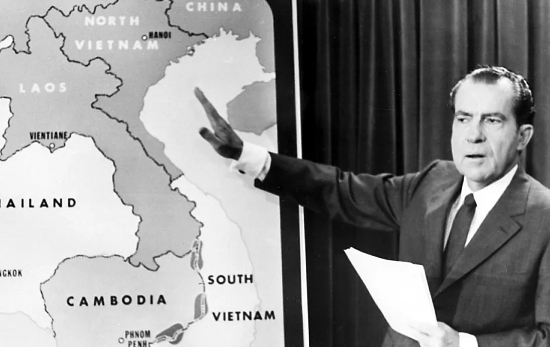 Nixon pointing at map