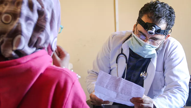 A doctor meets a patient in Syria