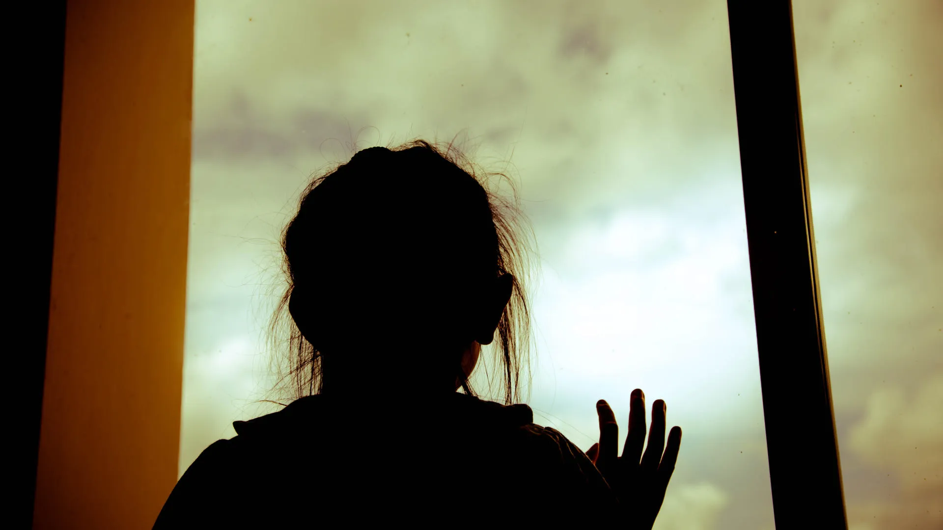 Child looking out of window