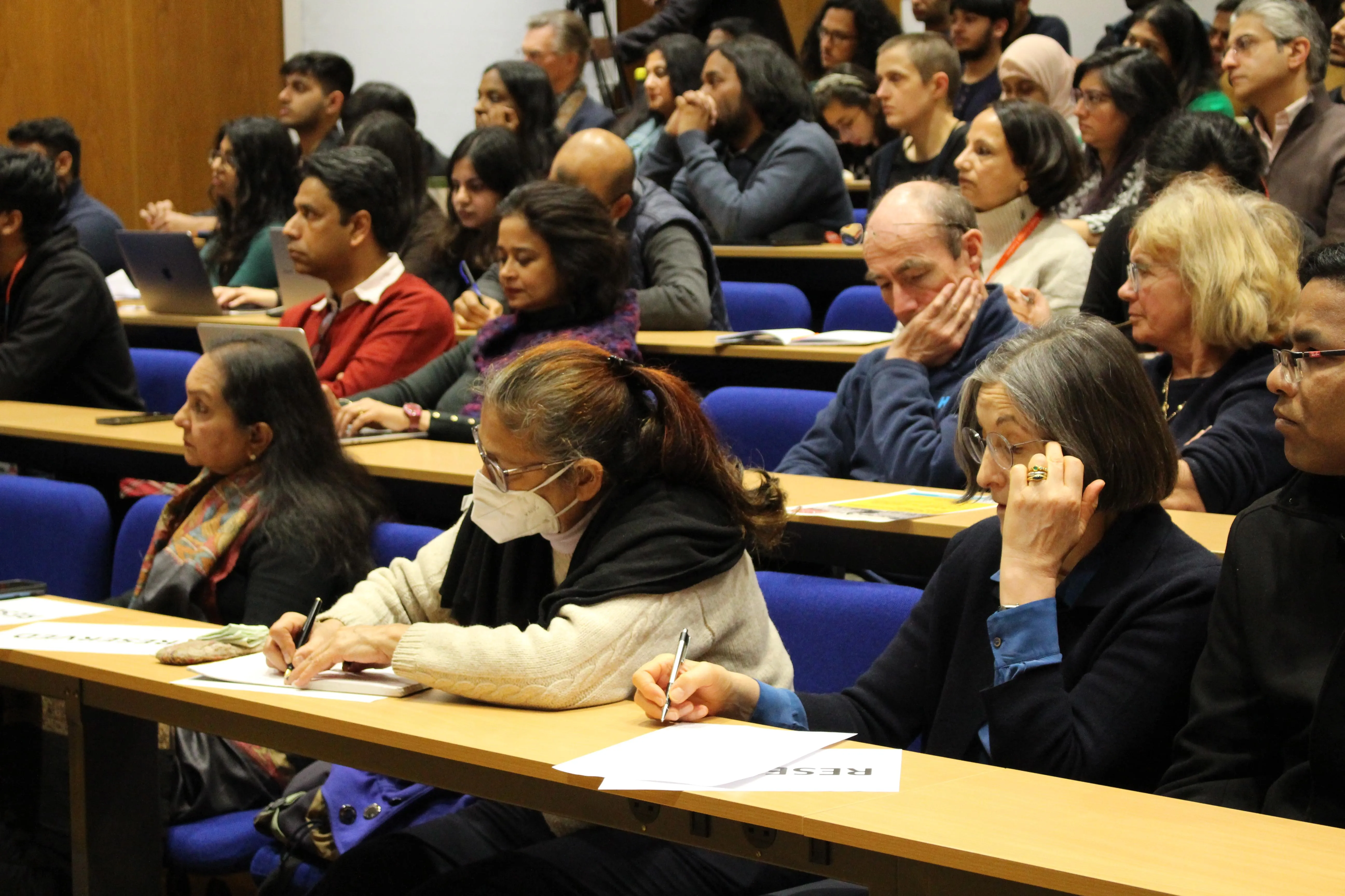 Audience members taking notes at the Nehru Memorial lecture 2023 by Prof Madhavan K Palat