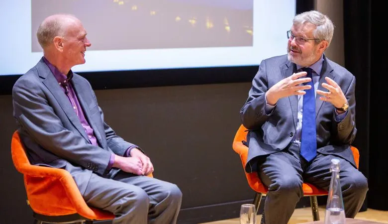 Professor George MacGinnis in conversation with Professor Thomas Scharf at the 2023 David Hobman Lecture, Institute of Gerontology.