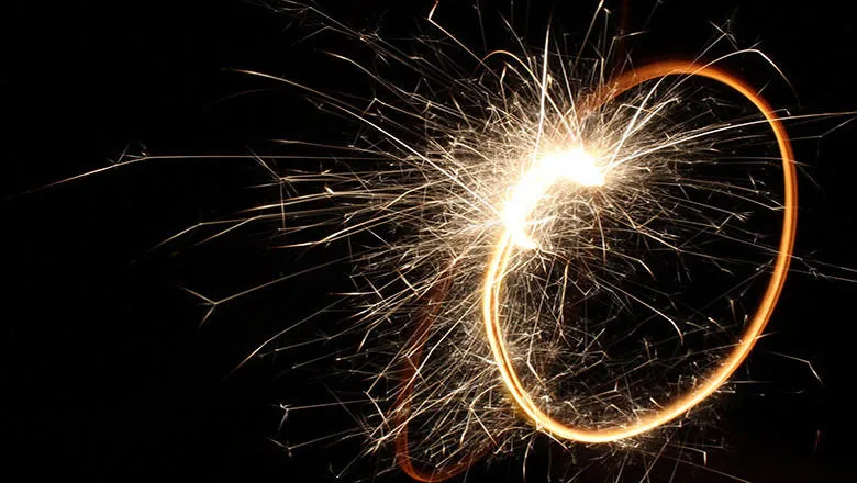 A sparkler against a dark background