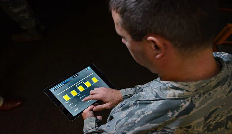 A soldier using a tablet computer